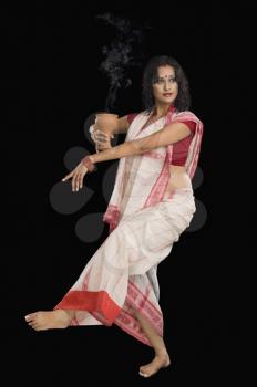 Bengali woman performing ritual dance