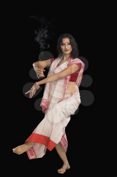 Bengali woman performing ritual dance