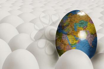 Egg with image of earth among plain white eggs
