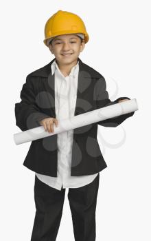 Girl dressed as an architect and holding a blueprint