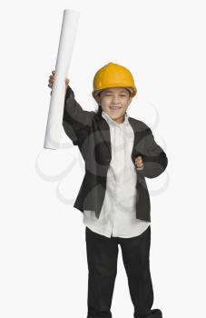 Girl dressed as an architect and holding a blueprint
