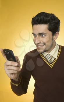 Businessman text messaging on a mobile phone