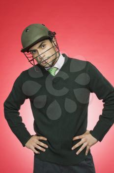 Businessman wearing a cricket helmet
