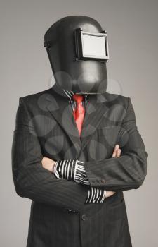 Businessman wearing a welding mask