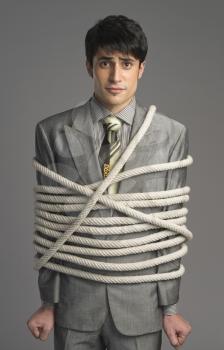 Portrait of a businessman tied up with ropes