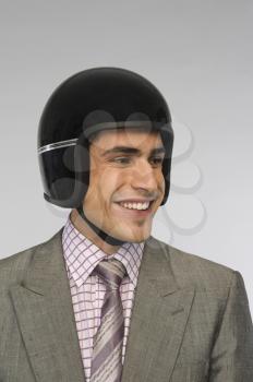 Close-up of a businessman wearing a helmet