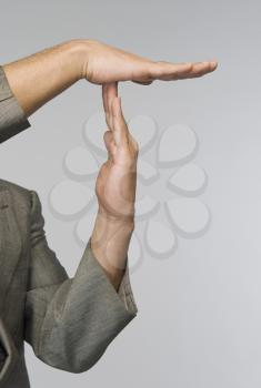 Businessman's hands making time out signal