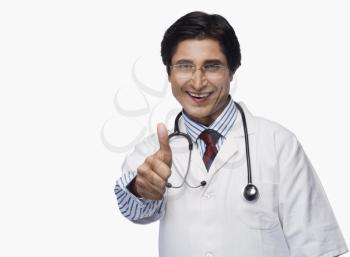 Portrait of a doctor showing thumbs up and smiling
