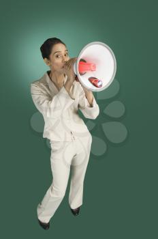 Businesswoman announcing with a megaphone