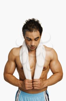 Man standing with a towel around his neck