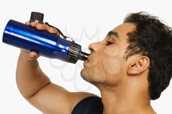 Man drinking water from a bottle