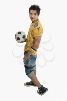 Portrait of a man holding a soccer ball