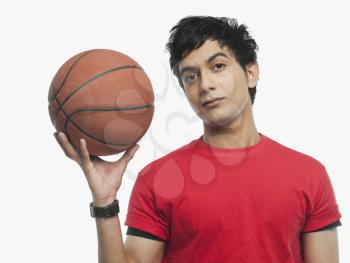 Portrait of a man holding a basket ball
