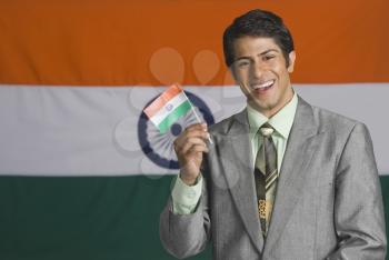 Portrait of a man in front of an Indian flag