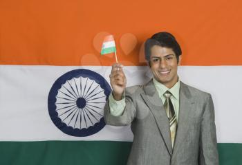 Portrait of a man holding Indian flag