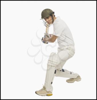 Cricket batsman playing a stroke
