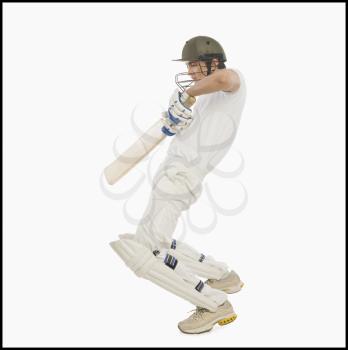 Cricket batsman playing a square cut shot