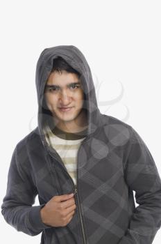 Man wearing a hooded shirt and smiling