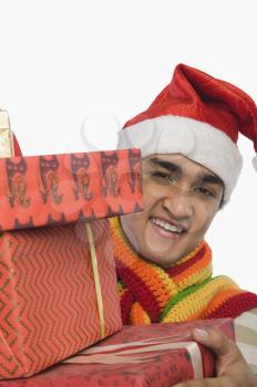 Portrait of a man holding Christmas presents