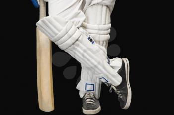 Low section view of a cricket batsman standing at a non-striker end