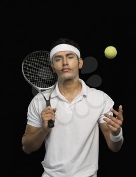Tennis player with a tennis racket and a ball