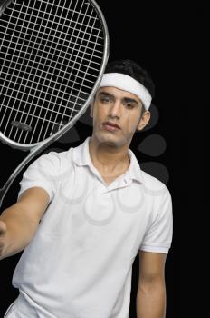 Tennis player showing a tennis racket