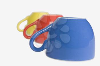 Close-up of colorful tea cups in a row