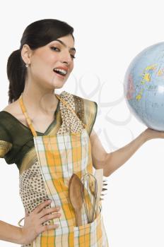 Woman holding a globe