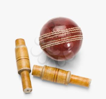 Close-up of a cricket ball and bails
