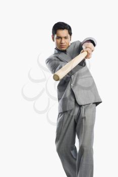 Businessman holding a baseball bat