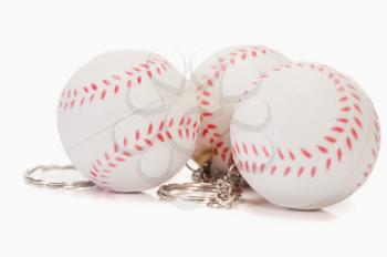 Close-up of baseball shaped key rings