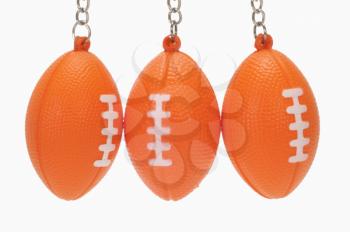 Close-up of American football shaped key rings