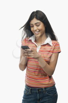 Close-up of a woman text messaging on a mobile phone