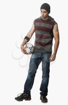 Portrait of a man holding a soccer ball