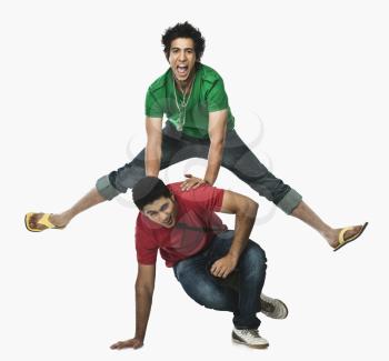 Two university students playing leapfrog