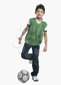 Portrait of a boy playing with a soccer ball