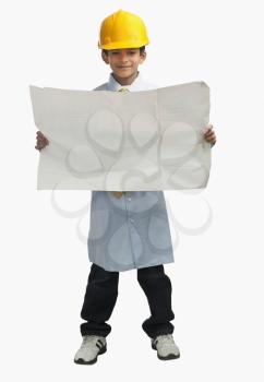 Boy dressed as an architect and showing a blueprint