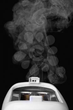 Close-up of a toaster releasing smoke