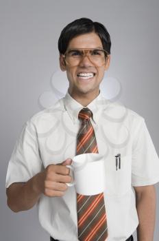 Man frowning over a coffee cup