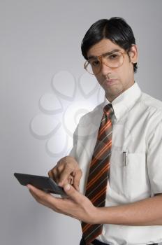 Man holding a calculator
