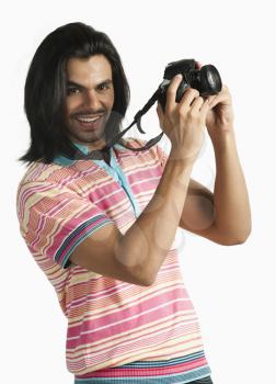 Photographer taking a picture with a digital camera