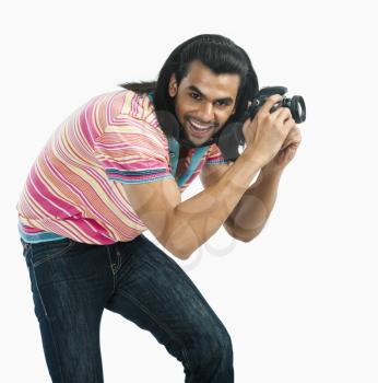 Photographer taking a picture with a digital camera