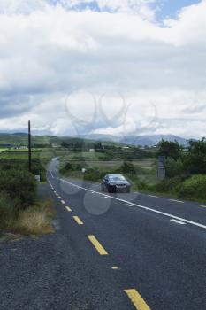 Car on the road, Ring Of Kerry, County Kerry, Republic of Ireland