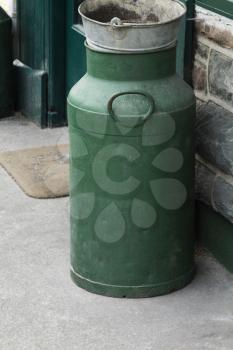 Milk canister near the door of a restaurant, Killarney, County Kerry, Republic of Ireland