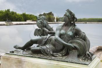 Statue at the poolside, Chateau de Versailles, Versailles, Paris, France