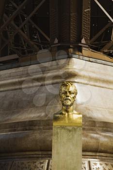 Bust of Gustave Eiffel near a tower, Eiffel Tower, Paris, France