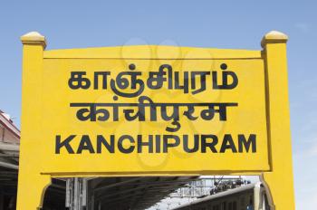 Station name board at a railroad station, Kanchipuram, Tamil Nadu, India