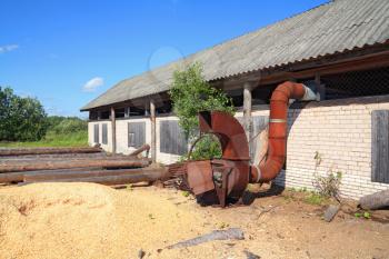 old rusty mechanism amongst sawdust 