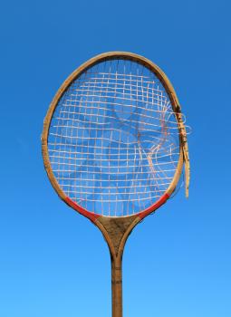 aging racket on celestial background