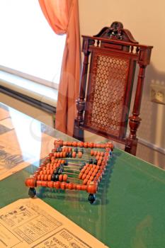 wooden abacus on green table